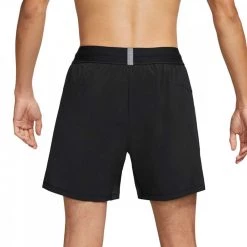 NIKE SHORT YOGA 2IN1 Nero -Strada Moda nike dc5320 short yoga 2in1 abbigliamento training e palestra uomo 042414501 010 2